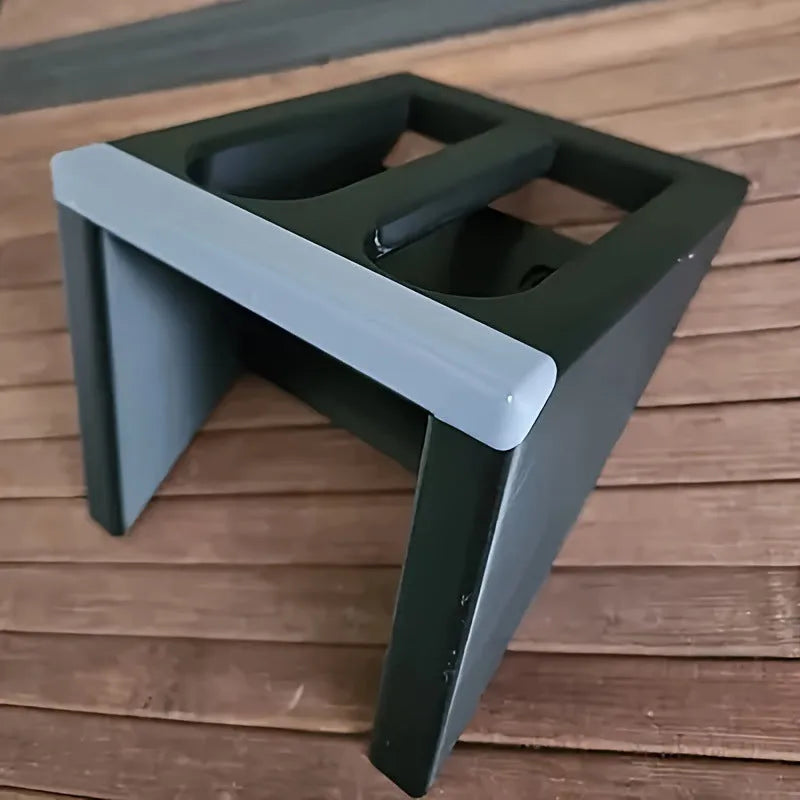 Black punk-style plastic pistol display stand for collectible airsoft pistols and models.