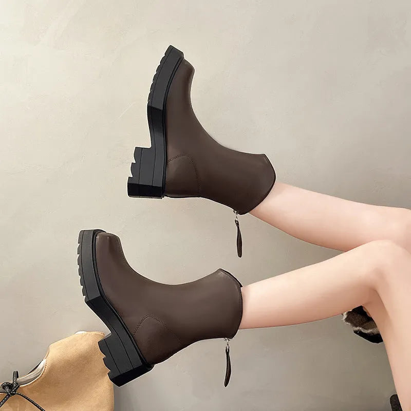 Black women's platform Martin boots with a square toe, mid-calf height, and a back zip.