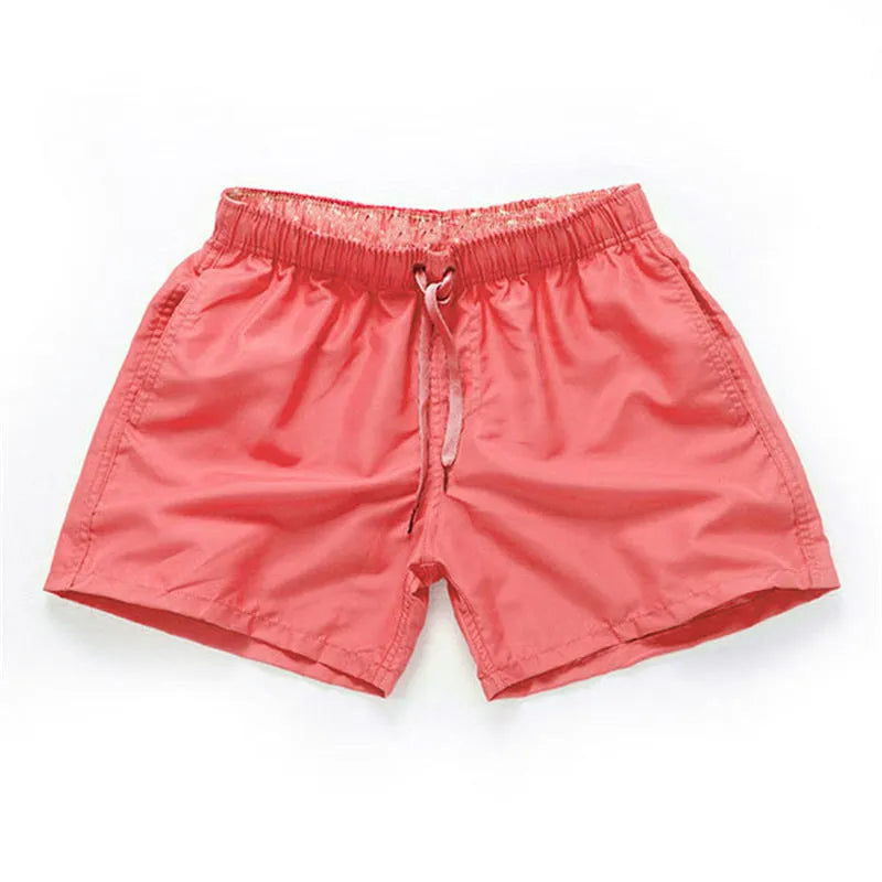 Men's polyester beach shorts for surfing in multiple colours including black white red and fluorescent options