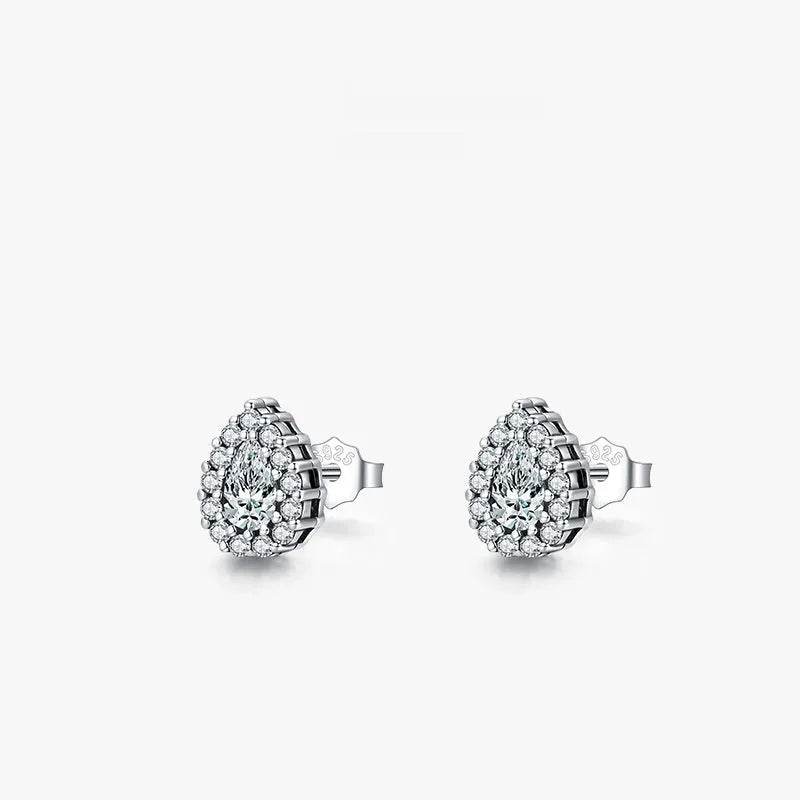 Close-up of women's sterling silver water drop shaped ear studs with diamond cut facets on a white background.