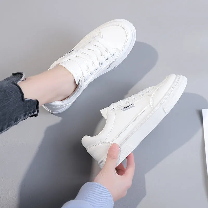 Women's low top Korean style sneakers in white or brown artificial PU leather with plastic sole.