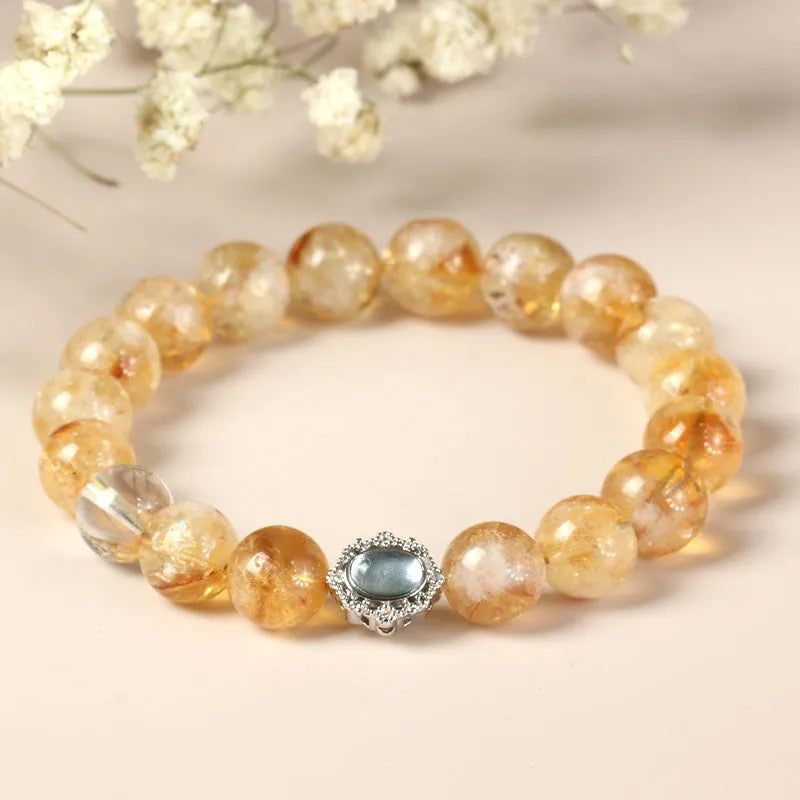 Citrine crystal bracelet with 10mm geometric faceted beads on wrist