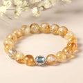 Citrine crystal bracelet with 10mm geometric faceted beads on wrist