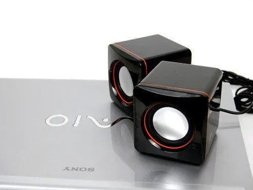 Small black square USB-powered 2.0 computer speaker for desktop audio