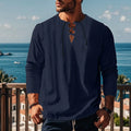 Men's loose fit cotton blend pullover shirt in a solid colour on a hanger.