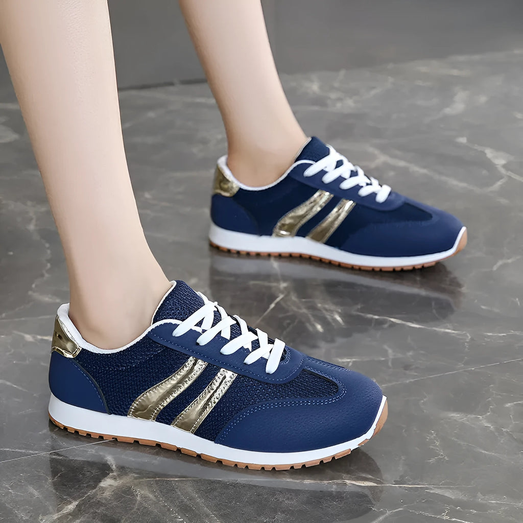 Blue women's casual tennis shoes with cross shoulder straps and white rubber sole