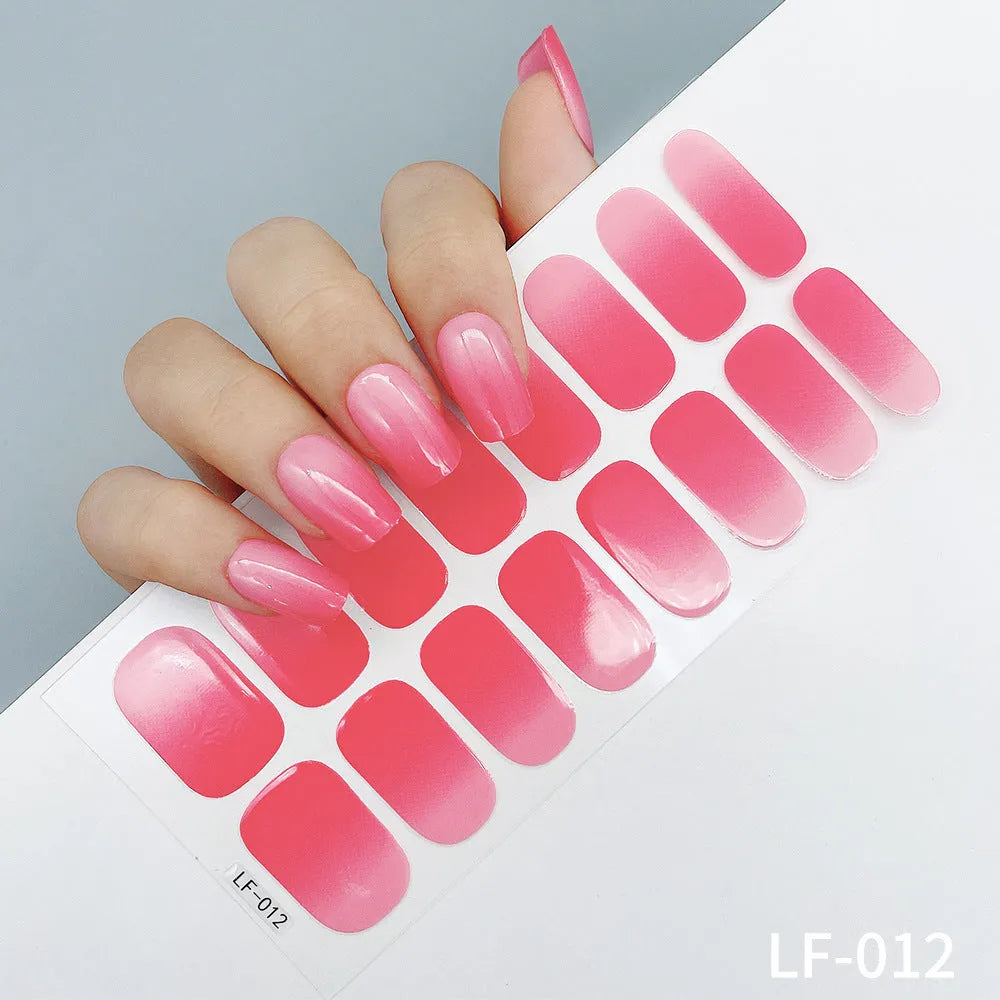 Full coverage nail art stickers sheet with 16 designs including cross, rose, tulip, and cartoon patterns.