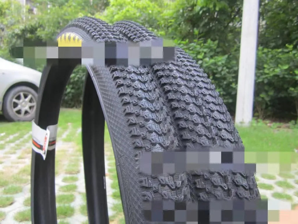 Ultralight puncture-resistant mountain bike tyre for 26, 27.5 and 29-inch wheels on a trail.
