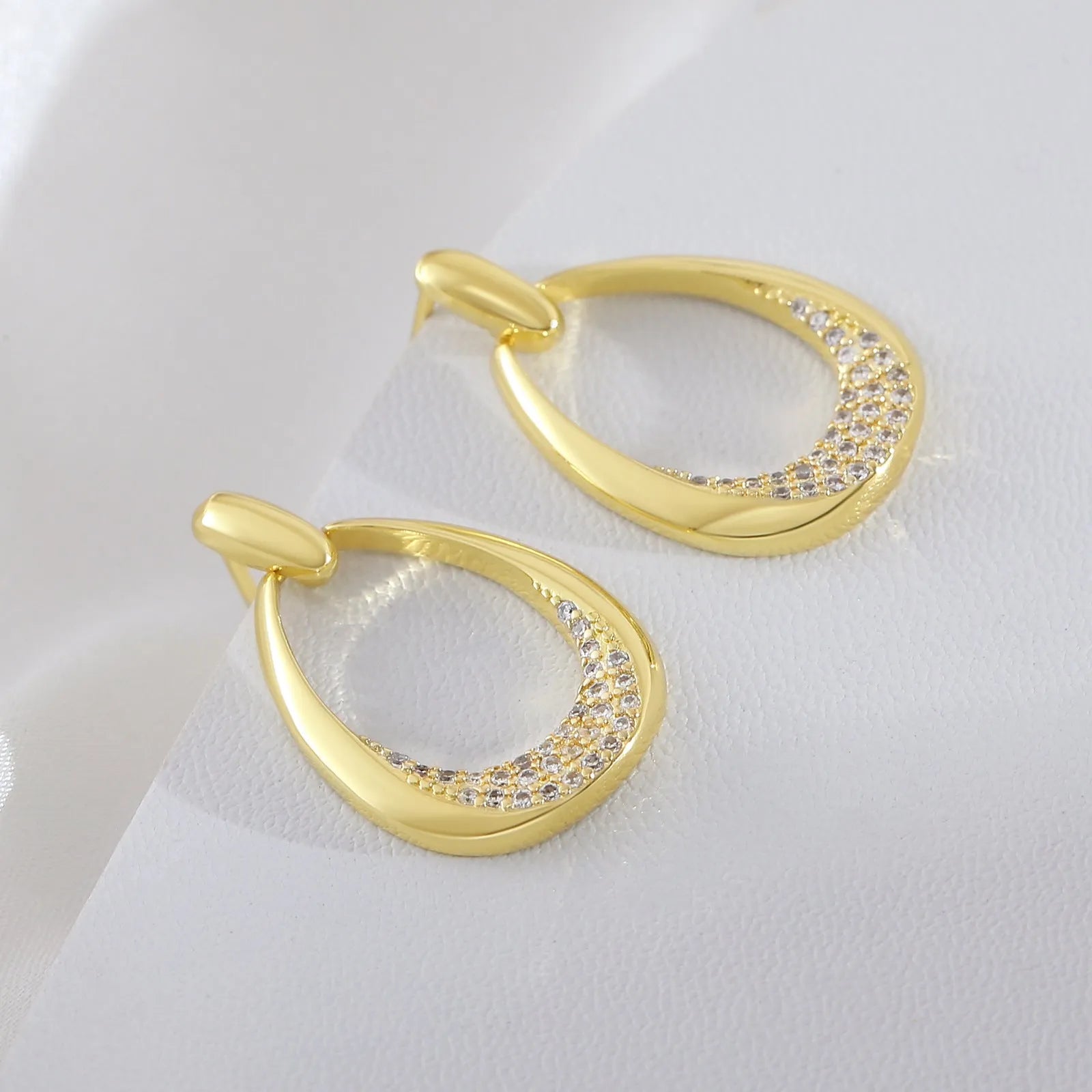 Women's copper geometric drop earrings with zircon details and electroplated yellow gold finish