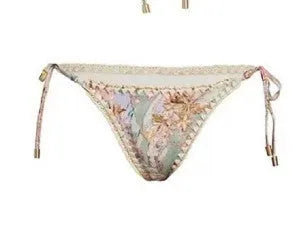 Women's creamy-white floral pattern bikini swimsuit set with top, briefs, and skirt