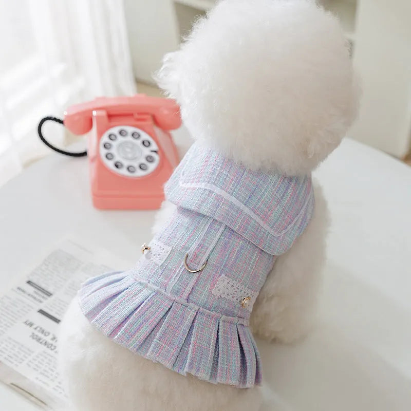 Purple or pink polyester pet clothing for a small dog or cat, showing size options S, M, L, XL.