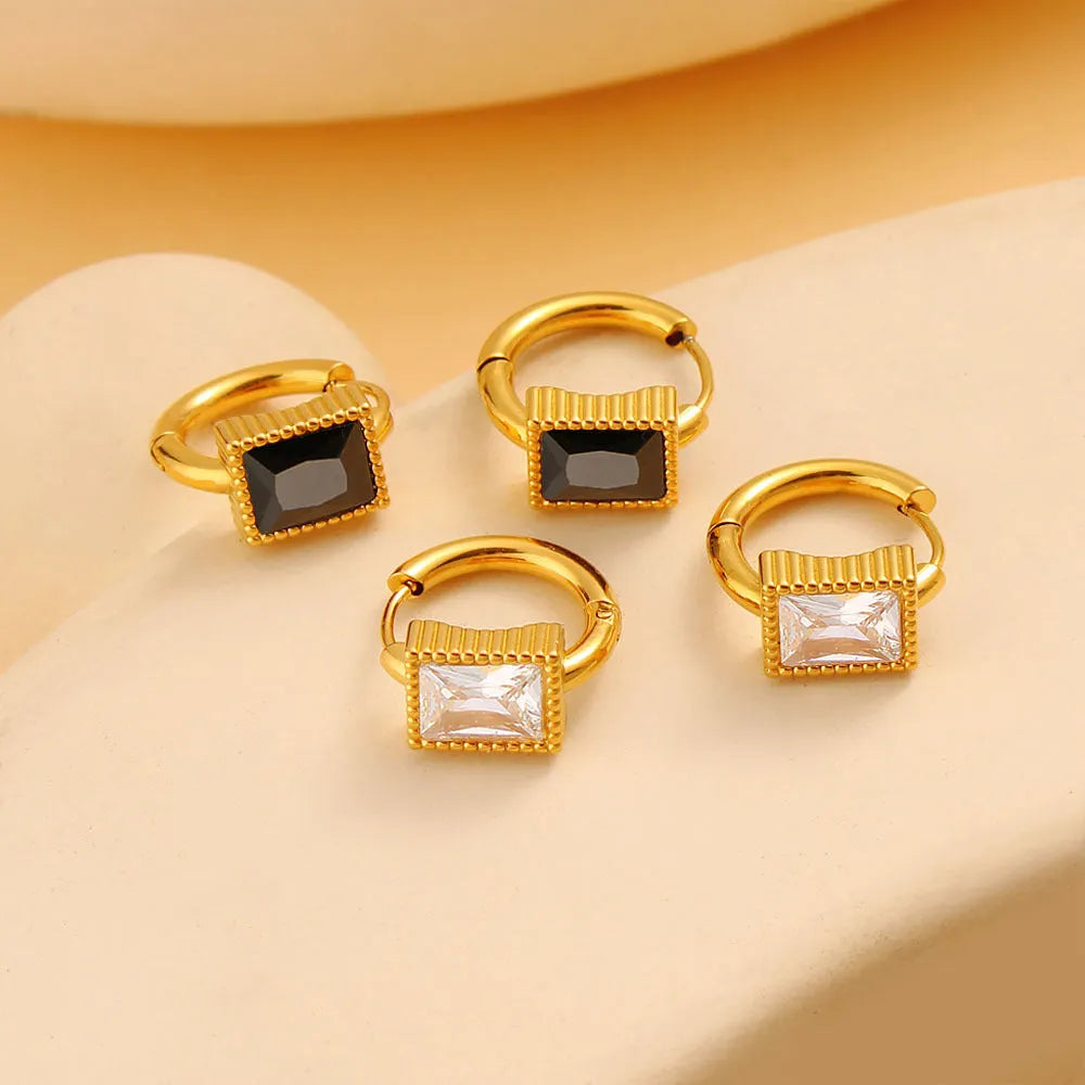 Geometric stainless steel earrings with square zircon stones and ring elements in electroplated colours