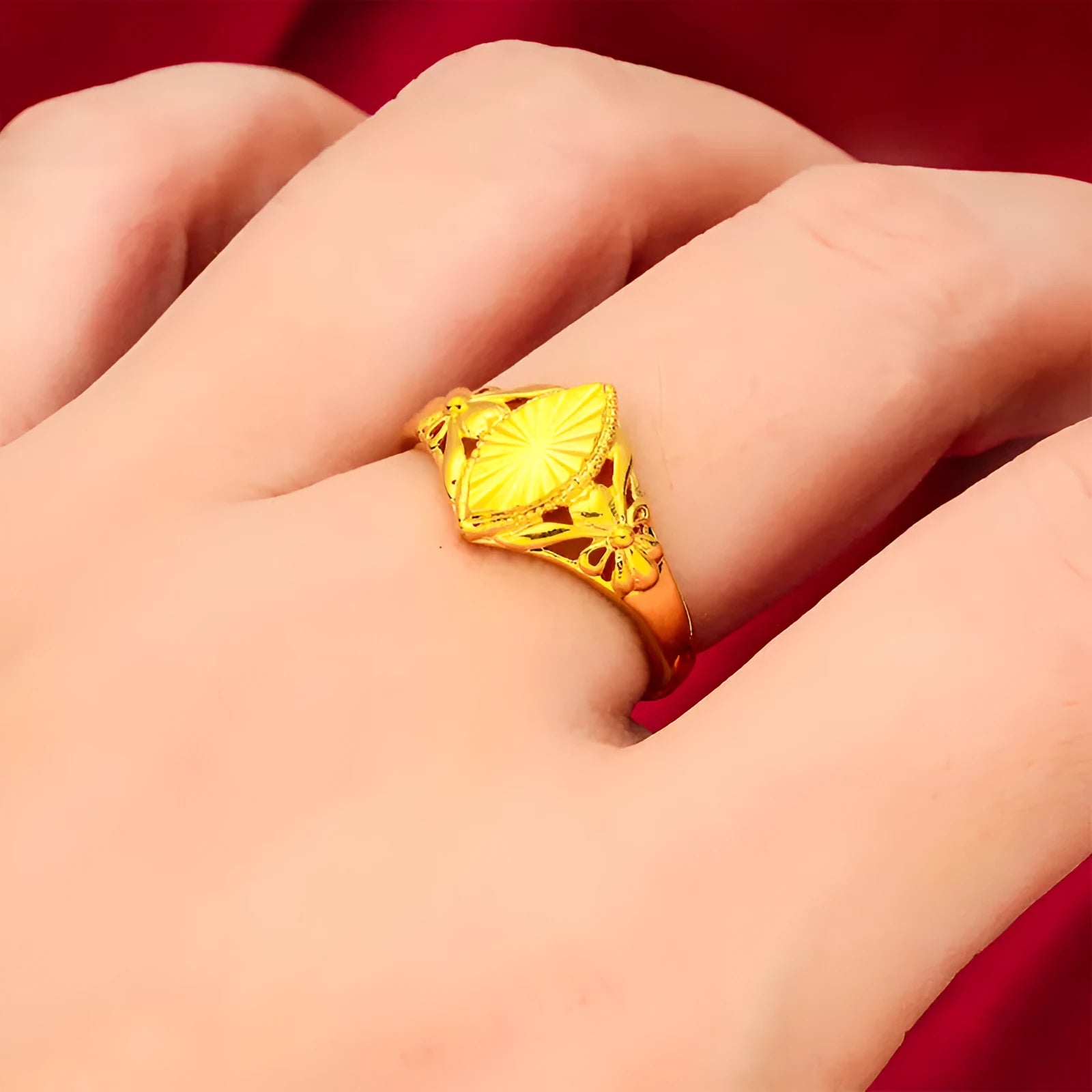 Gold-coloured geometric brass ring with textured design elements for women