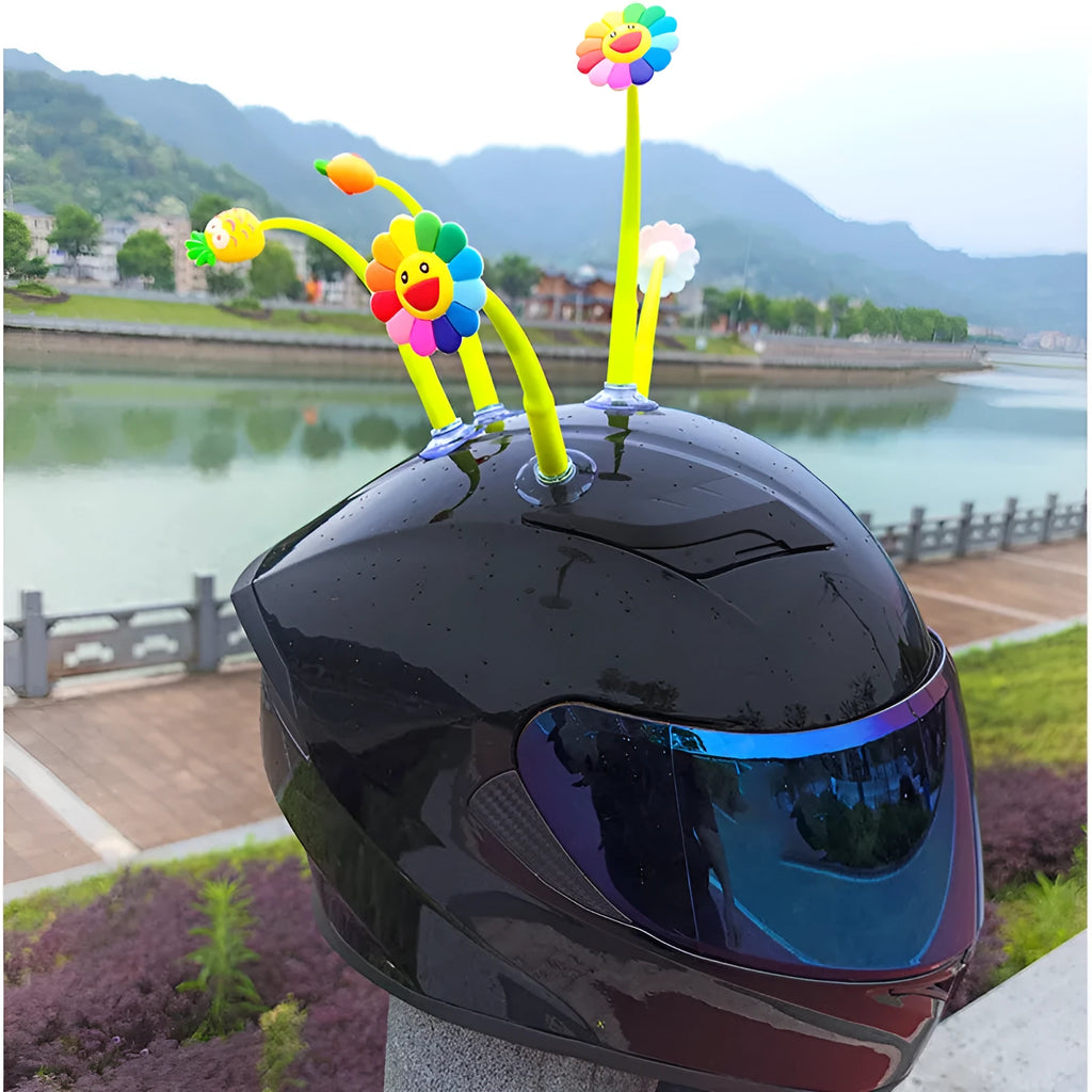 Yellow silicone sunflower helmet decoration with suction cup on a motorbike helmet.
