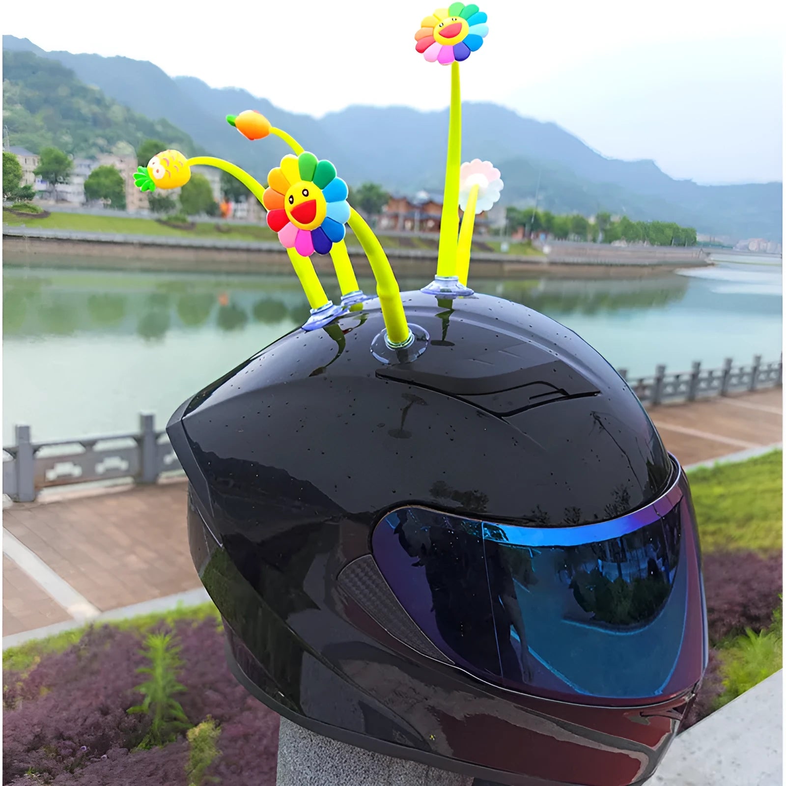 Yellow silicone sunflower helmet decoration with suction cup on a motorbike helmet.