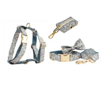 Blue floral patterned cloth dog collar with matching leash, vest, bow, and poop bag set for pet gifts