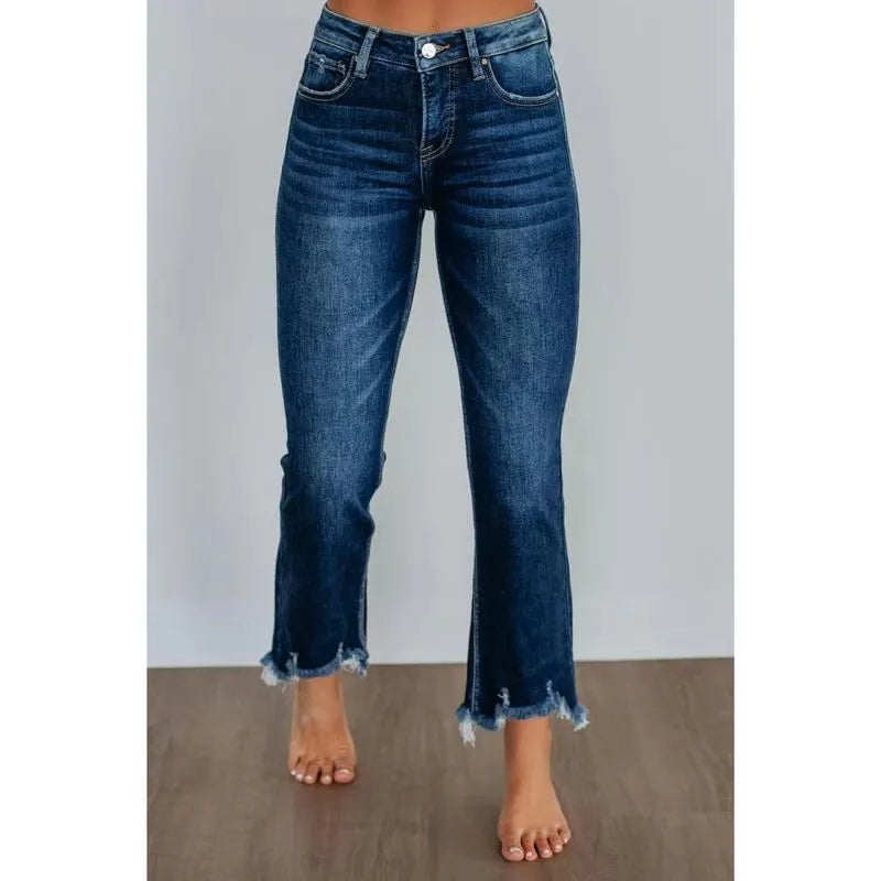 Women's solid colour denim jeans with a hand-worn finish in dark blue and light blue options.