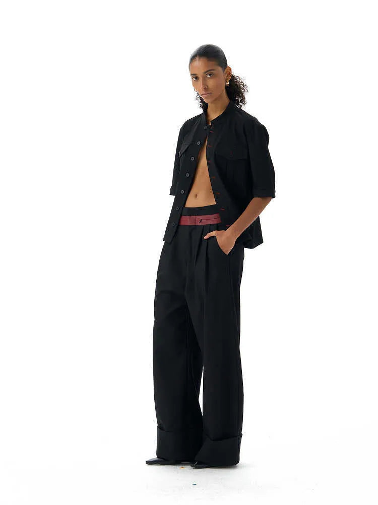 Handmade black loose fit half sleeve button-down shirt for men, shown on a hanger.