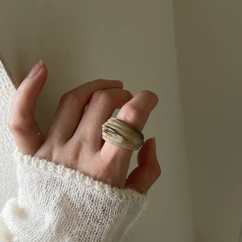 Geometric irregular resin ring in free size, shown in Maillard brown colour.