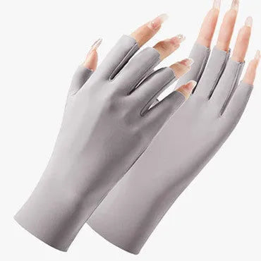 Thin beige women's ice silk sunscreen gloves with UPF50 protection on a hand.