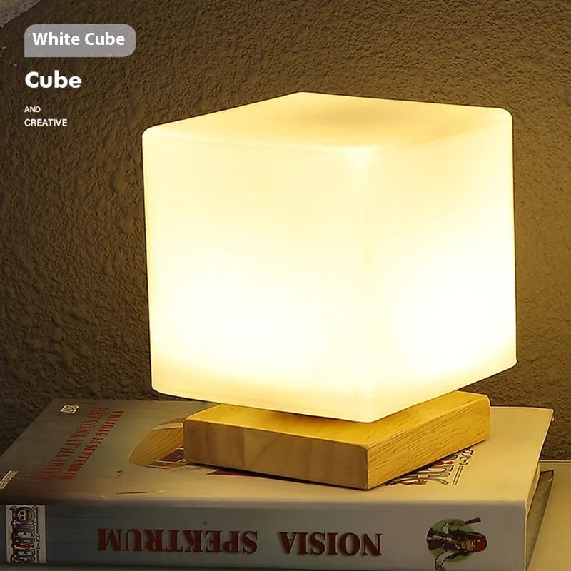 Nordic solid wood USB table lamp with touch dimming in white cube style on wooden surface
