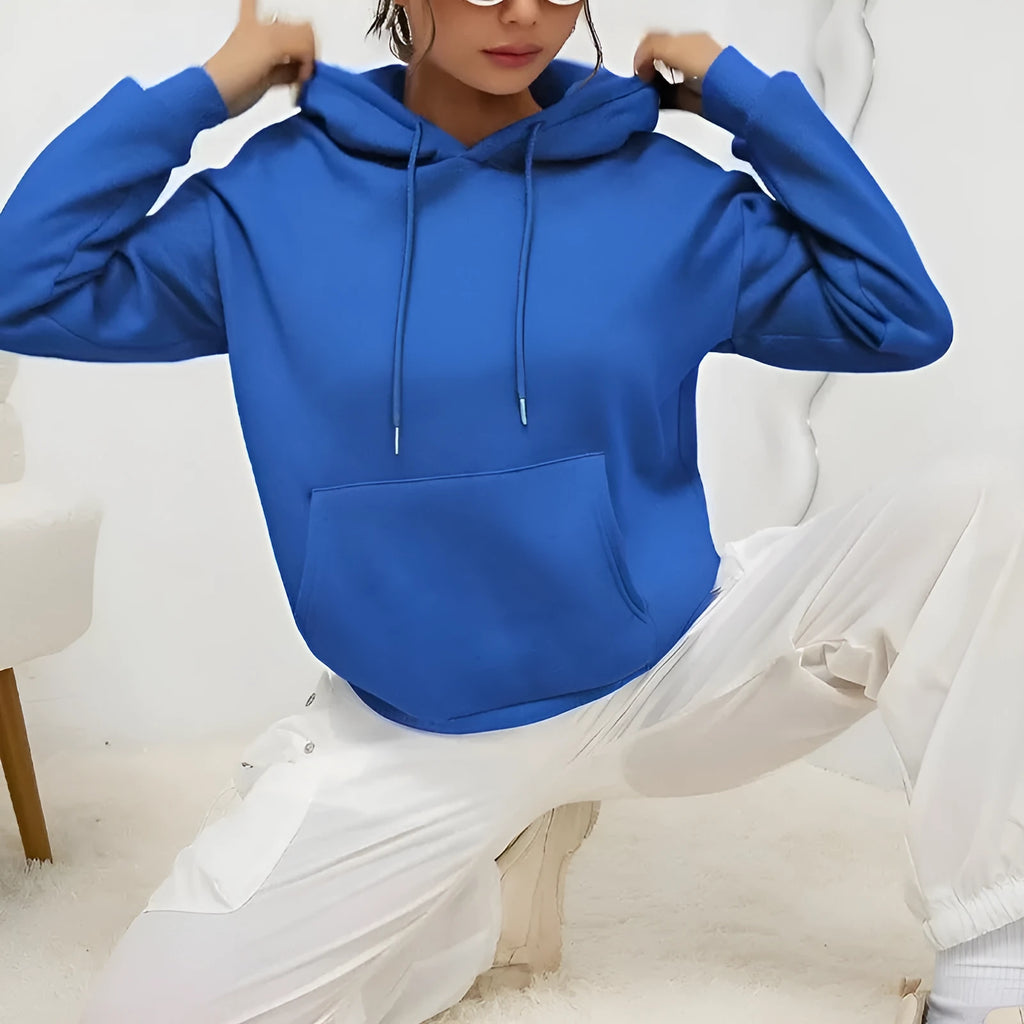 Women's loose fit grey hooded sweatshirt with drawstring and front pocket, long sleeves.