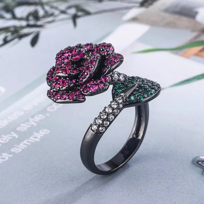 Black gold geometric flower ring with diamond-treated simulation red corundum stone