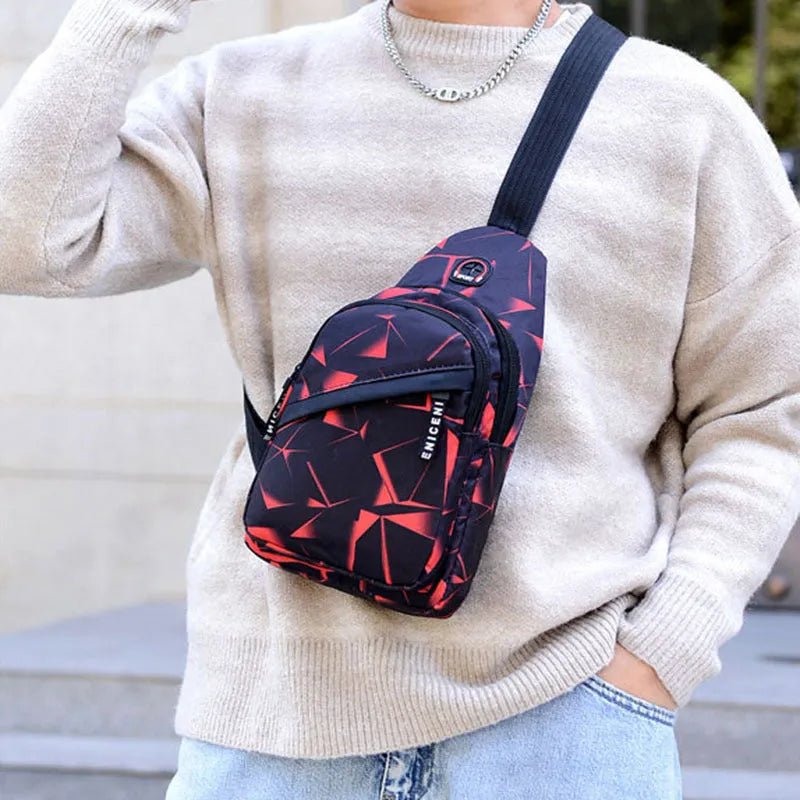 Black Oxford cloth crossbody chest bag for men with a visible earphone hole and zipper.