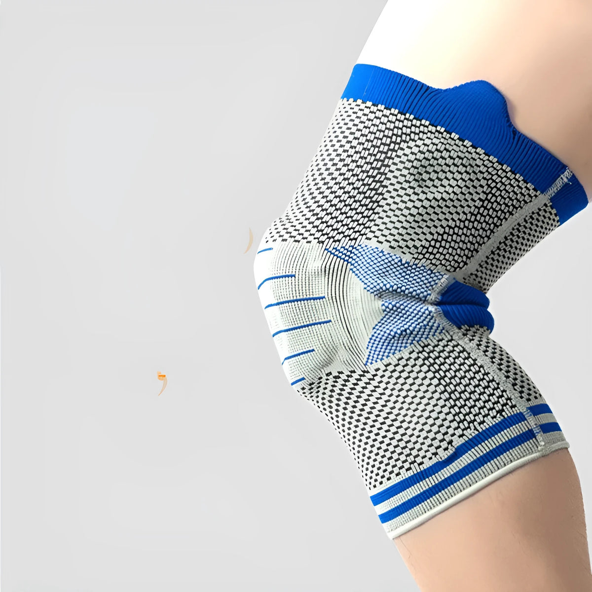 Silicone massage spring bar knee protector in cotton, shown in black and blue colour on a leg.