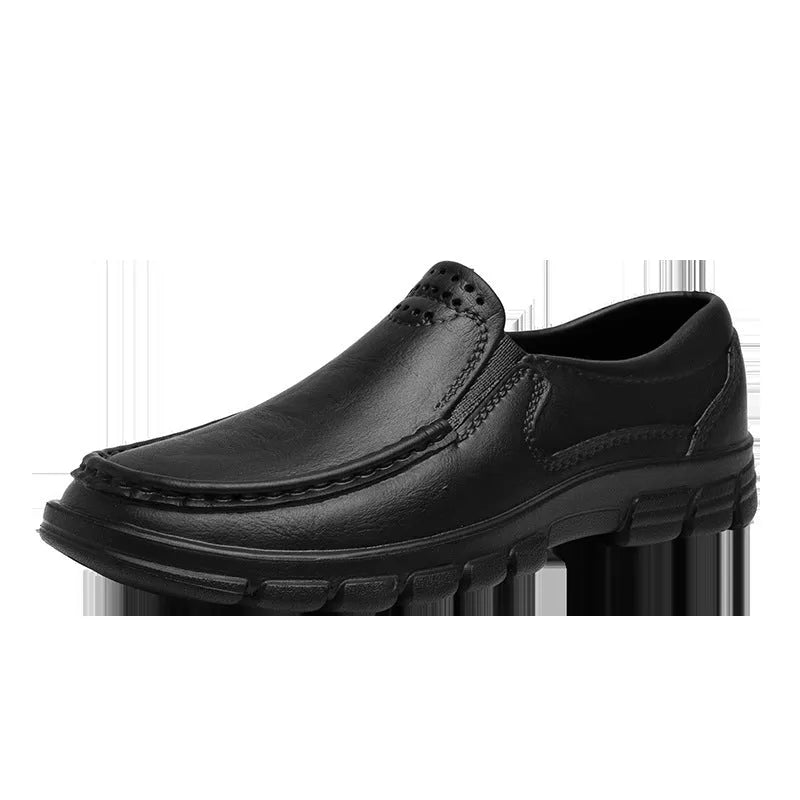 Men's black slip-on work shoes with a mid-top waterproof platform sole on a white background.