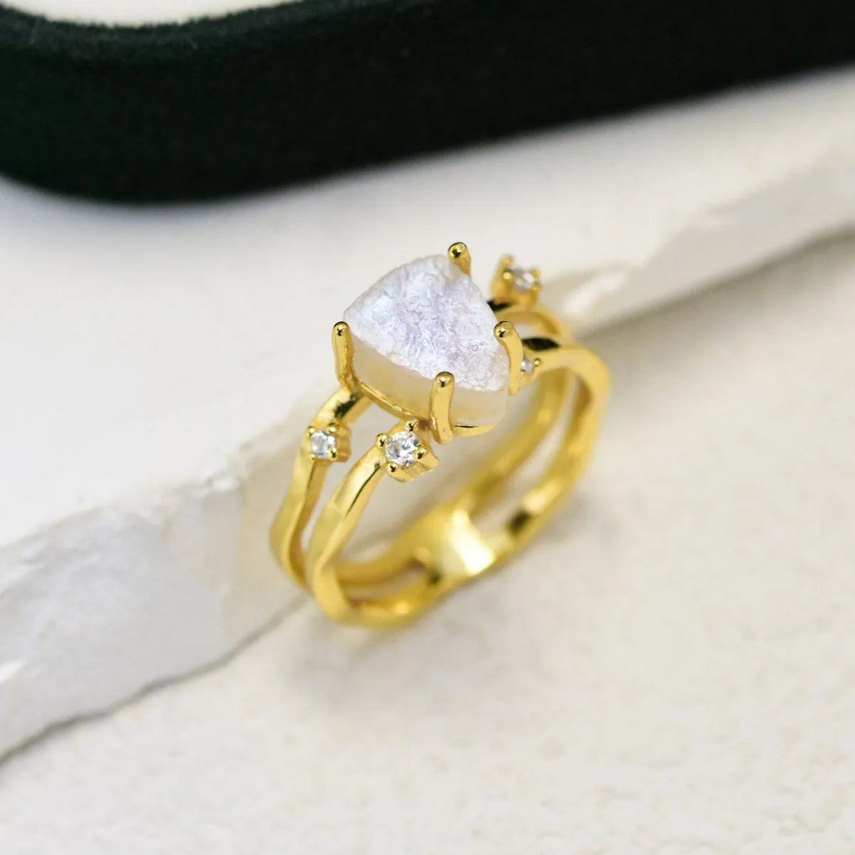 S925 sterling silver moonstone ring with geometric triangle shape on jewellery display