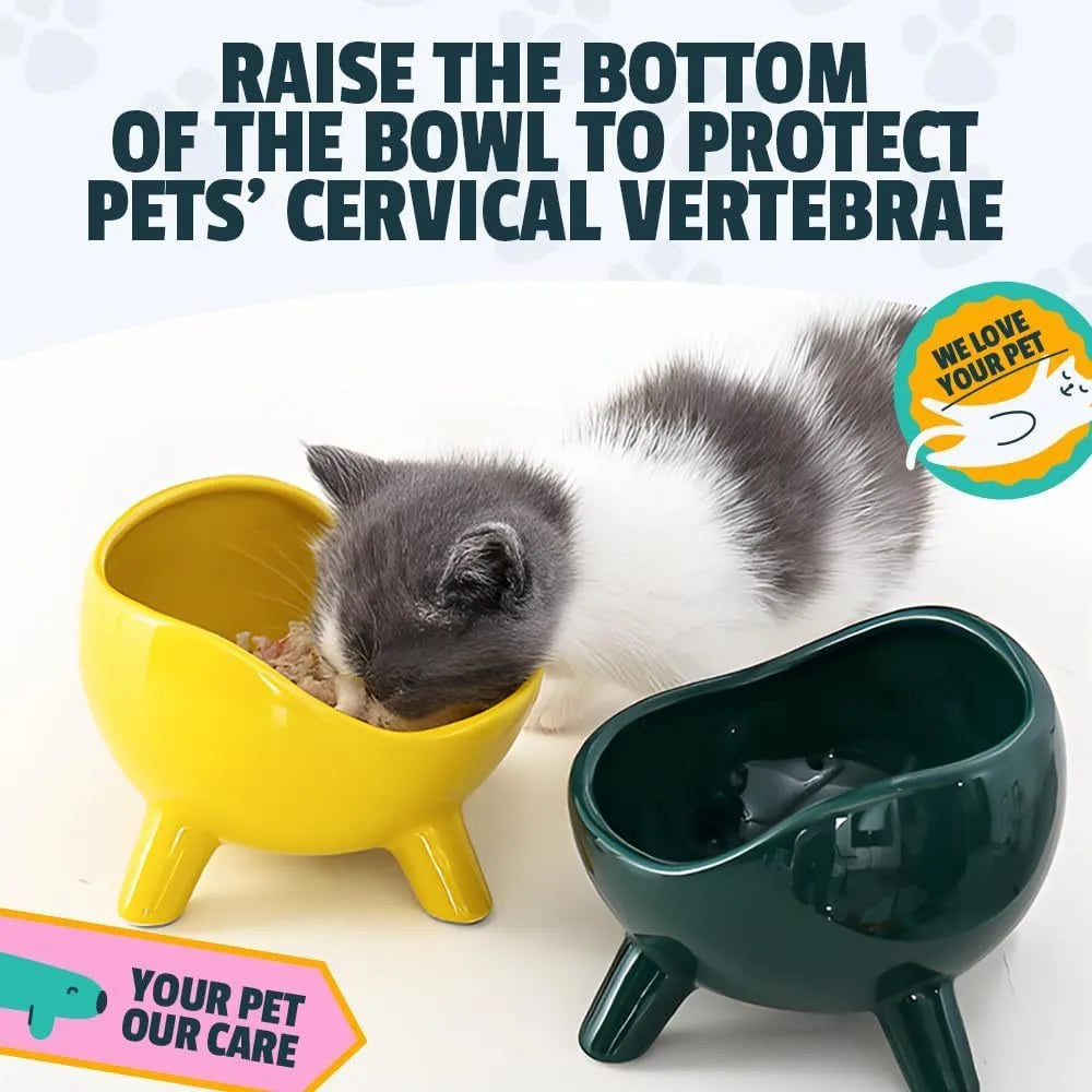 Green ceramic pet food bowl with four legs and a wide, rounded opening.