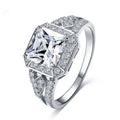 Platinum-colour zircon ring with hollow geometric quadrilateral design on a copper base
