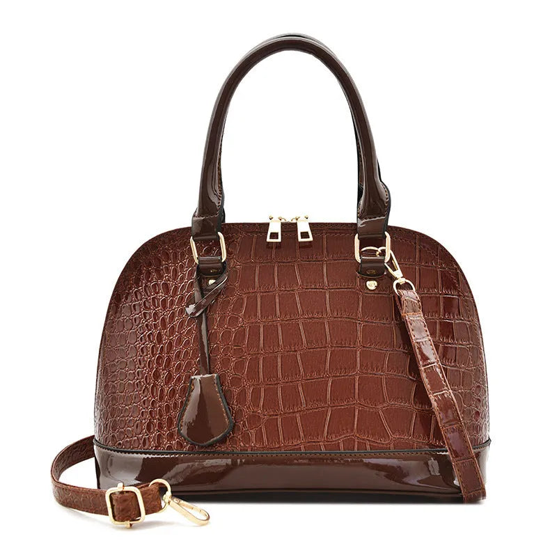 Large shiny PU leather crossbody bag in shell shape design on adjustable strap