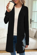 Long sleeve loose fit knitted cardigan jacket with pockets in polyester fabric.