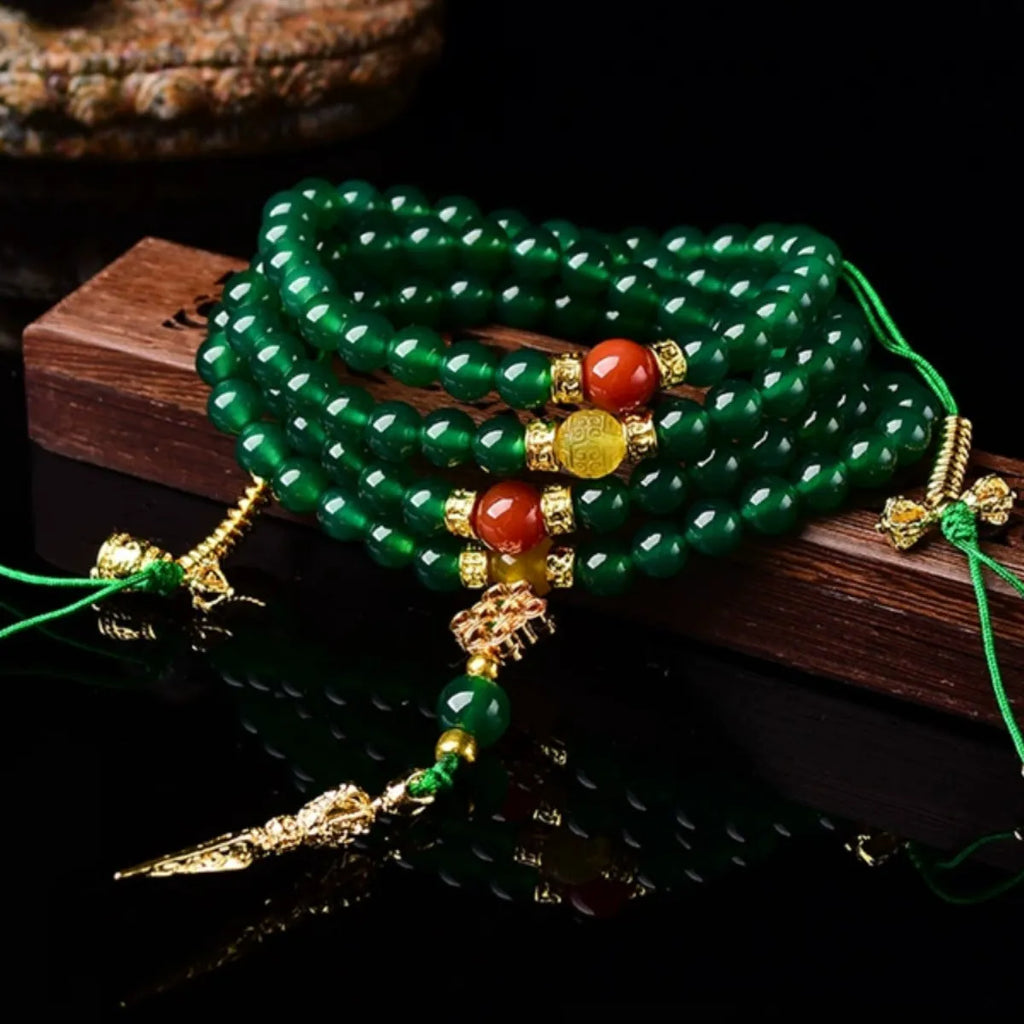 Handcrafted multi-circle green agate bracelet with natural stone beads on a wrist.