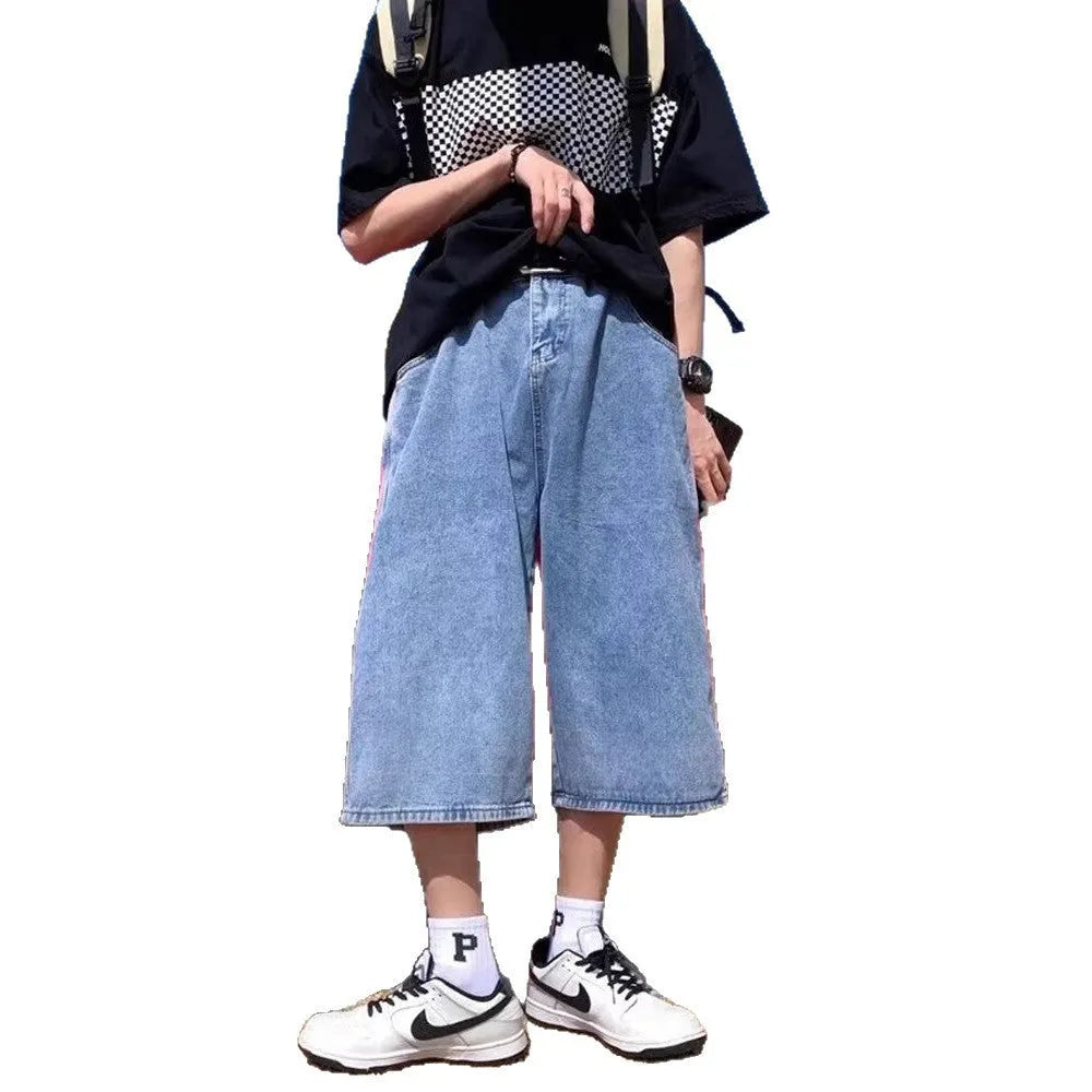 Blue men's washed denim pirate shorts with a high waist and cropped length on a hanger.