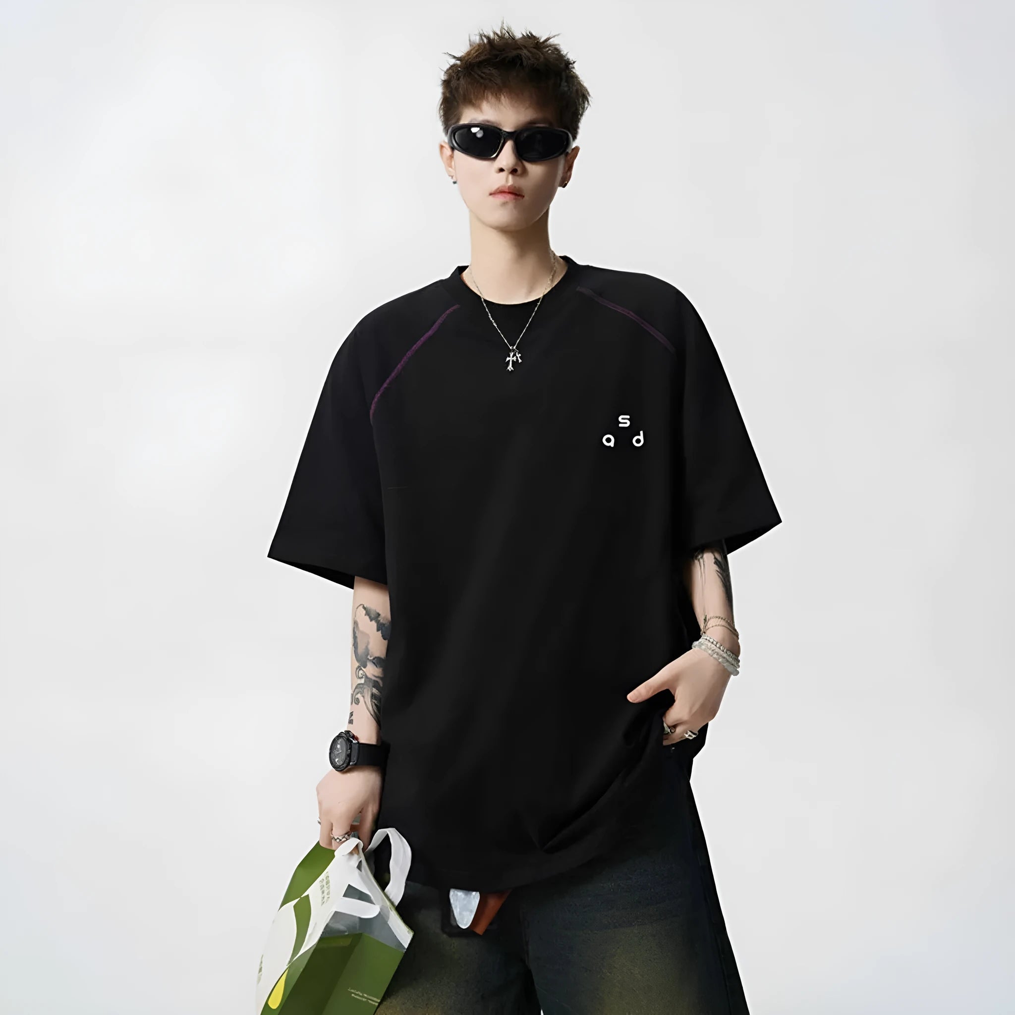 Men's loose fit cotton short-sleeve T-shirt with a printed letter design, shown in available colours.