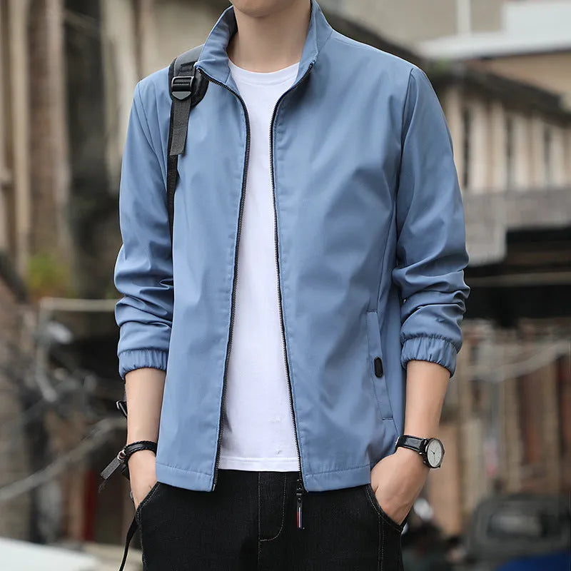 Man wearing a black Korean-style loose lapel casual jacket with zipper pockets