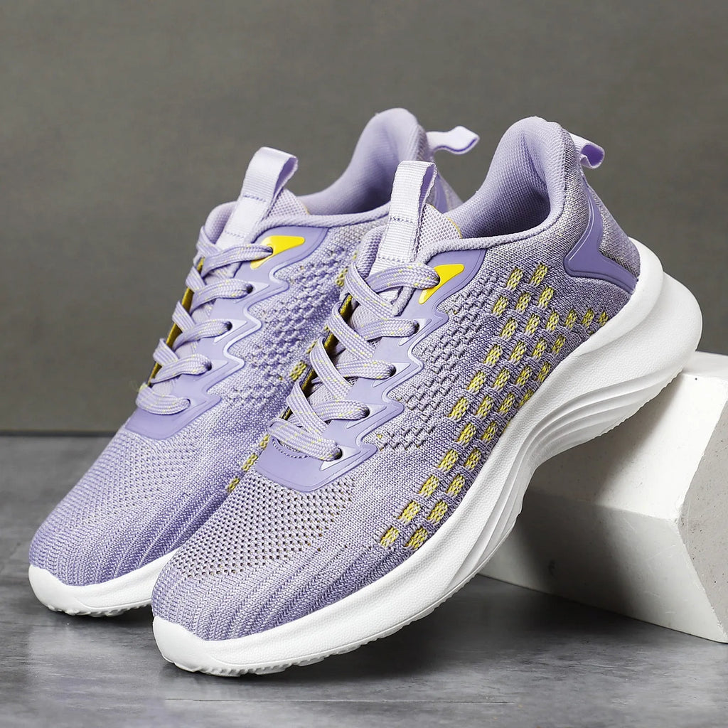 Women's lavender purple Flyknit running shoes with mesh lining and striped pattern for athletic use