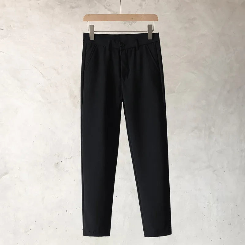 Boys slim straight wool trousers in grey, showing tapered fit and straight leg opening.