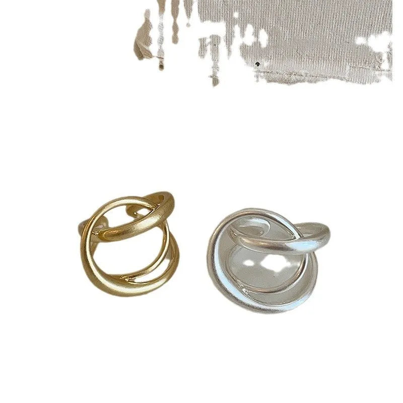 Three-dimensional interlaced geometric open ring in matte metal with gold or silver plating
