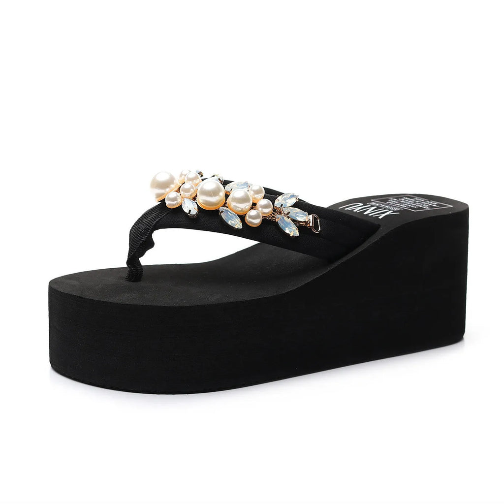 Women's black cotton high-heeled flip-flops on a white background
