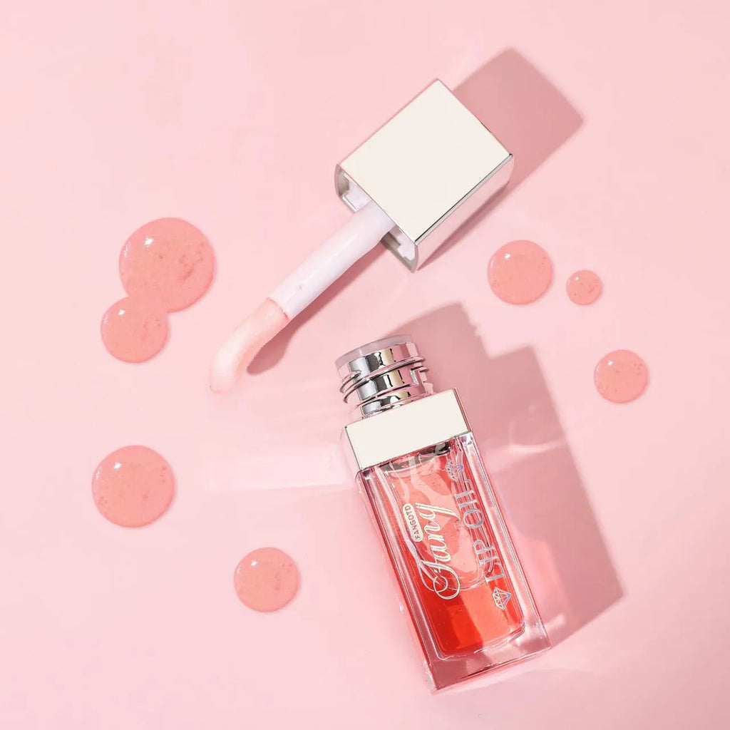 Five colour options of bright lip gloss mint lipstick with lip essence oil applicator