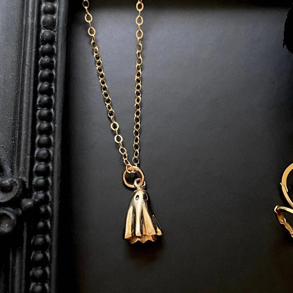 Ghost pendant necklace with titanium steel ghost charm on a stainless steel chain.
