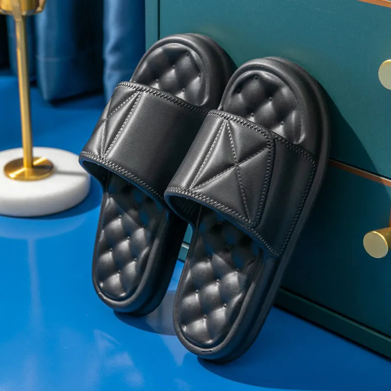 A pair of thick-soled EVA bathroom slippers in a chosen colour, showing the non-slip sole pattern.
