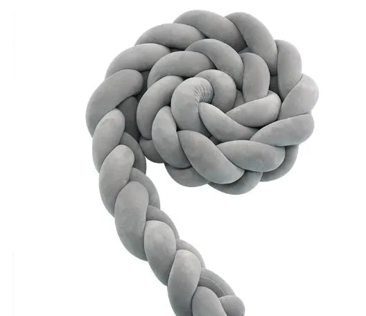 Braided knot cot bumper cushion in spandex velvet for crib safety protection.