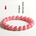 Women's geometric crystal bracelet with Longevity Lock in natural red rhodochrosite stone.