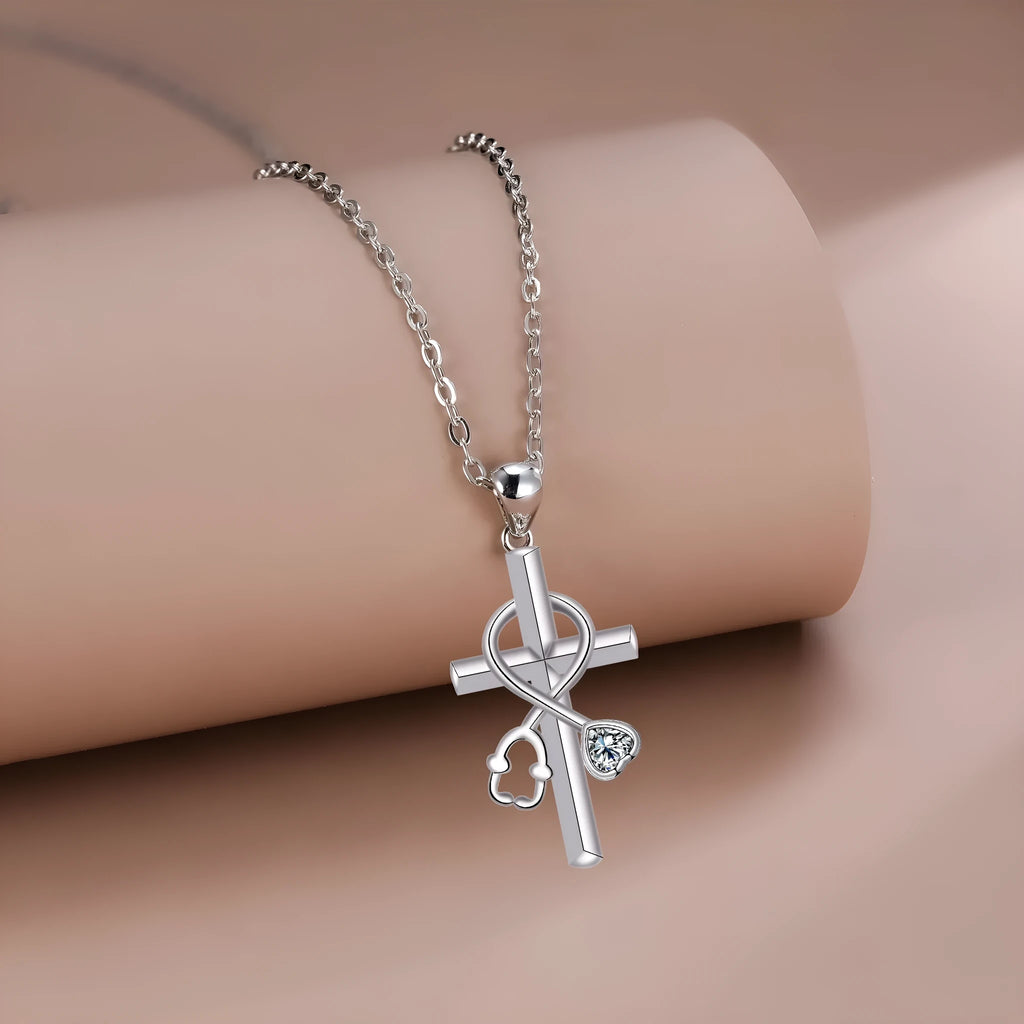 Close-up of a copper stethoscope pendant necklace on a cross-link chain for women.