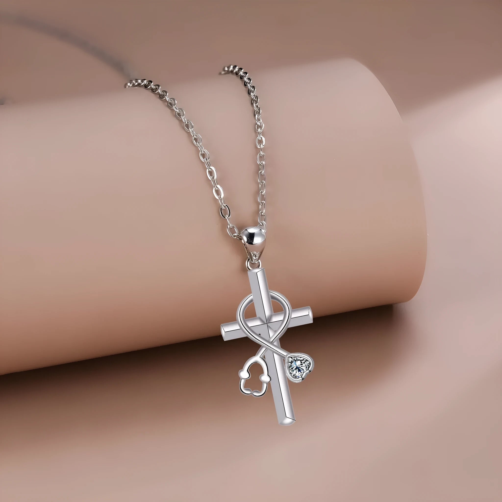 Close-up of a copper stethoscope pendant necklace on a cross-link chain for women.